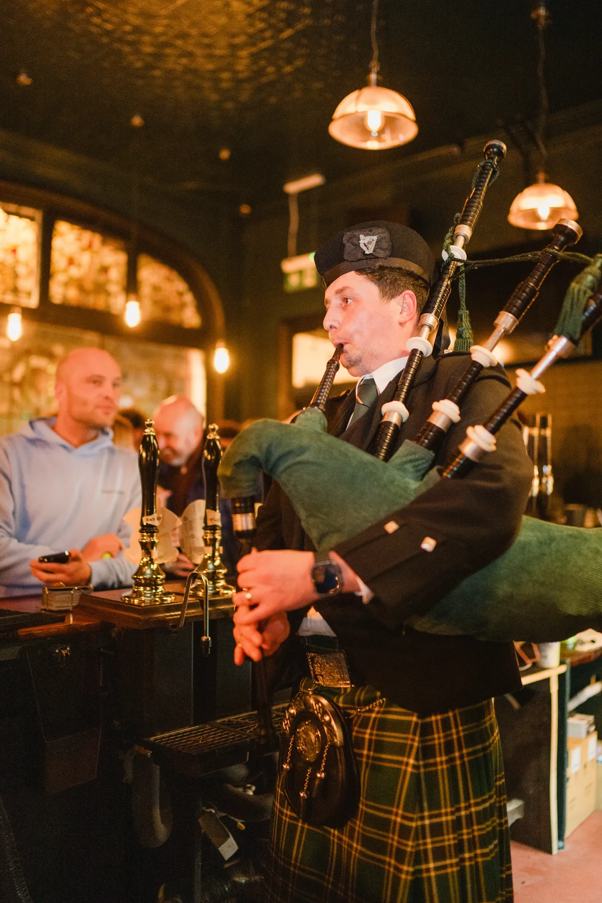 Ceremonial bagpiper performing inside the public bar at The Anchor Digbeth relaunch