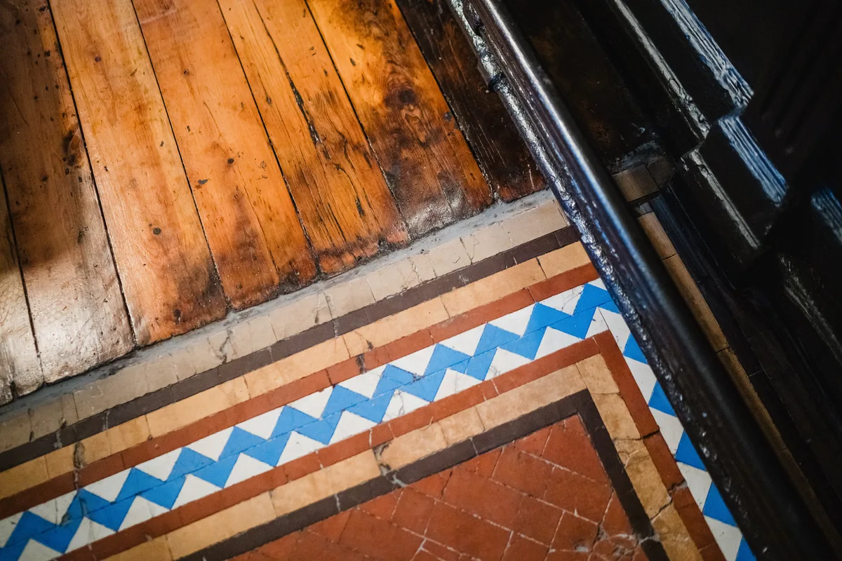 Original 1901 Minton encaustic ceramic floor tiles and seasoned timber boards at The Anchor Digbeth