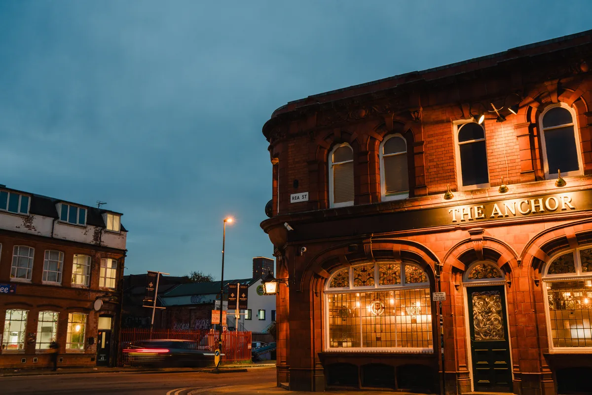 The Anchor Digbeth 1901 Grade II listed red terracotta corner elevation at dusk