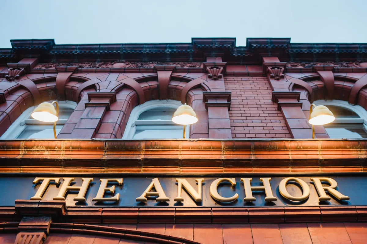 Hathern Station buff-red glazed terracotta blocks and gilded fascia signage at The Anchor Digbeth